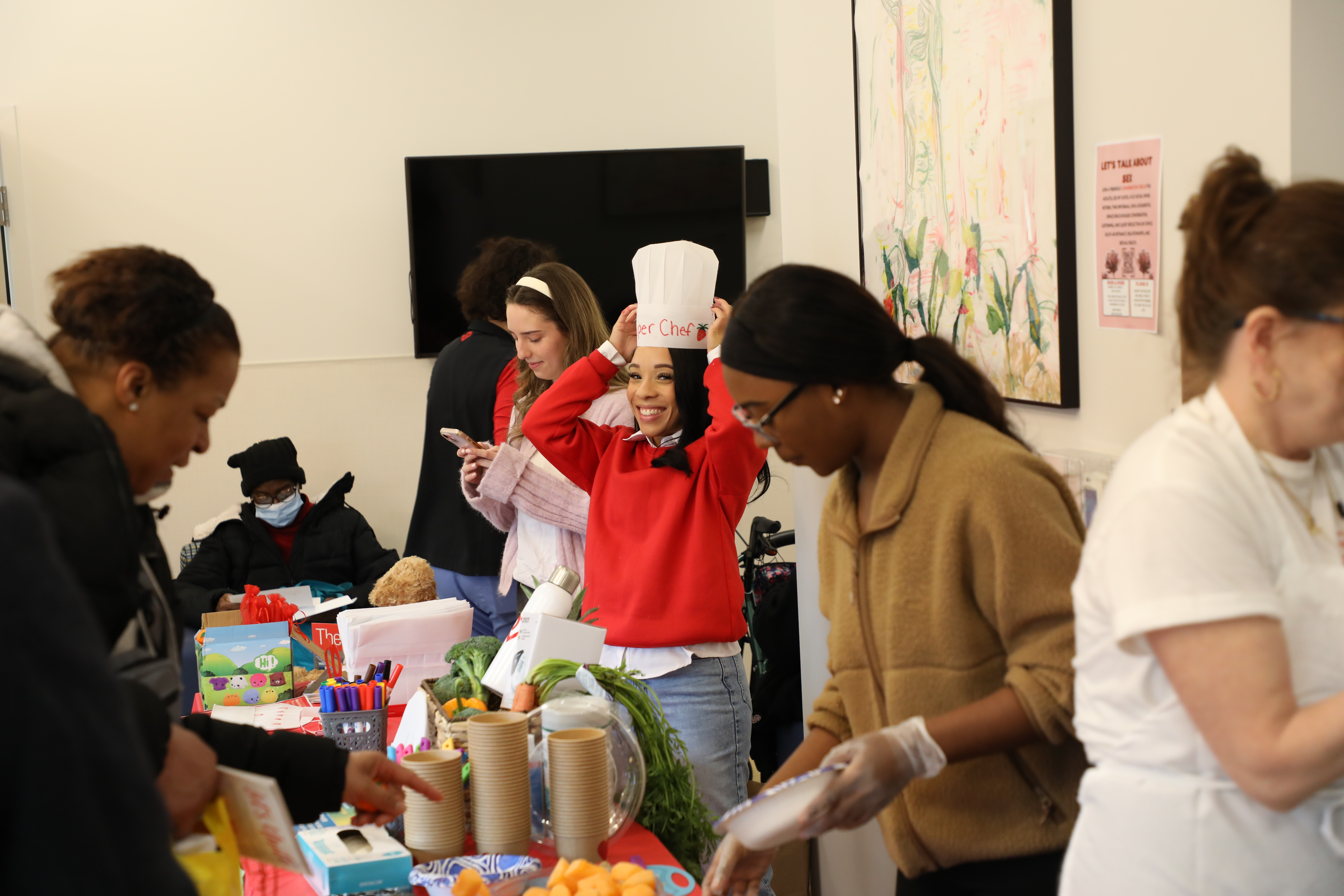 Community members participate in a hands-on health and nutrition activity at the VCU Health Hub.
